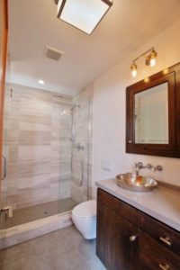 Stone Shower With Basin And Modern Fixtures